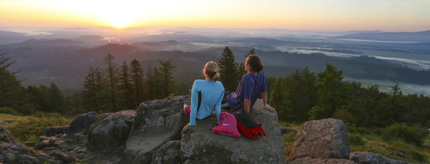 Students sitting utop Skinners Butte