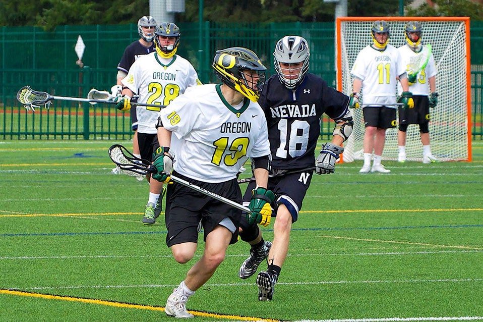 Lacrosse players competing on Student Recreation Center Turf Field